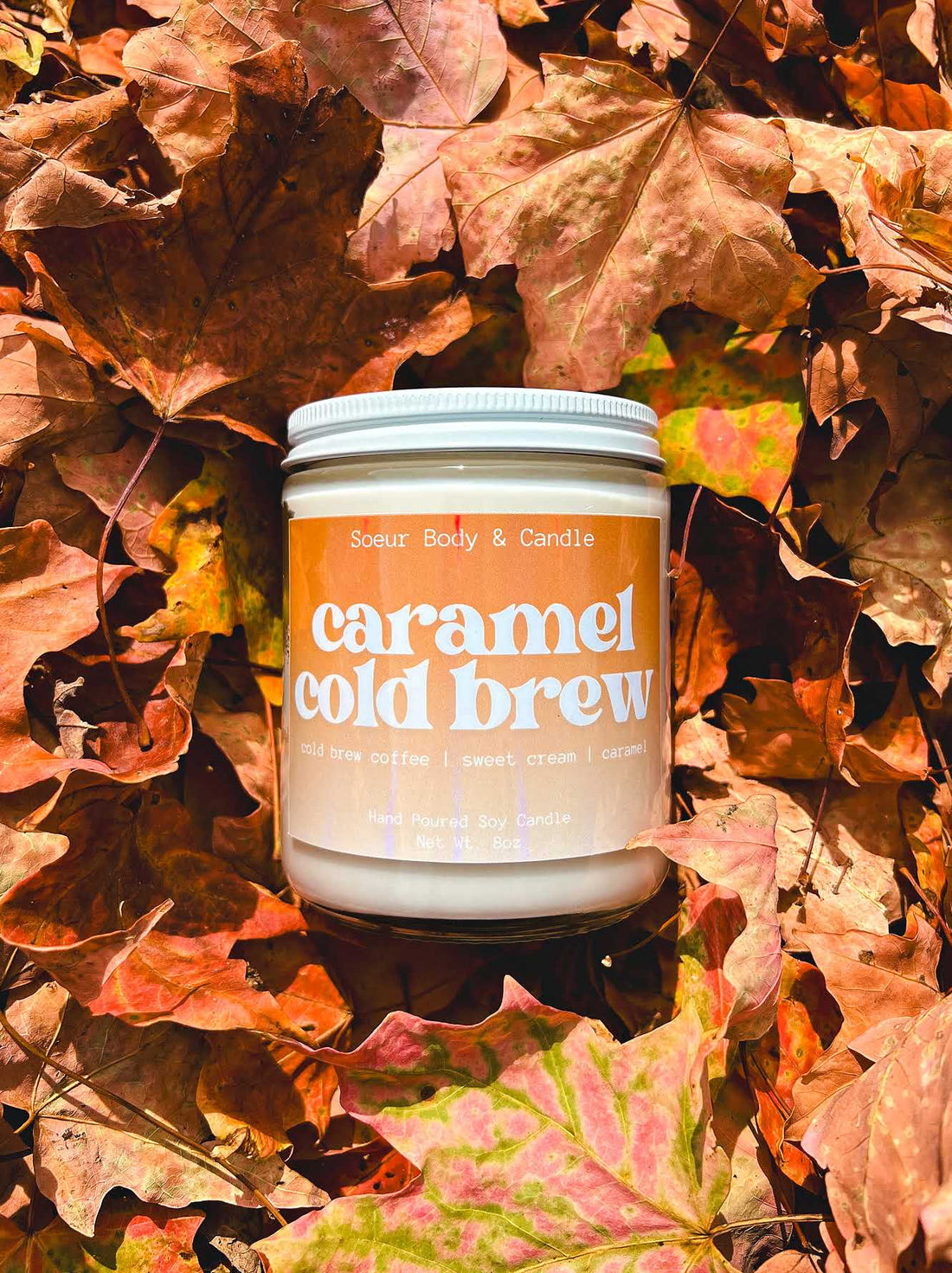 Caramel Cold Brew Soy Wax Candle with scents of cold brew coffee, sweet cream, and caramel that lasts up to 45 hours! Cruelty-free, vegan, handmade, paraben and phthalate free, and sustainably packaged.