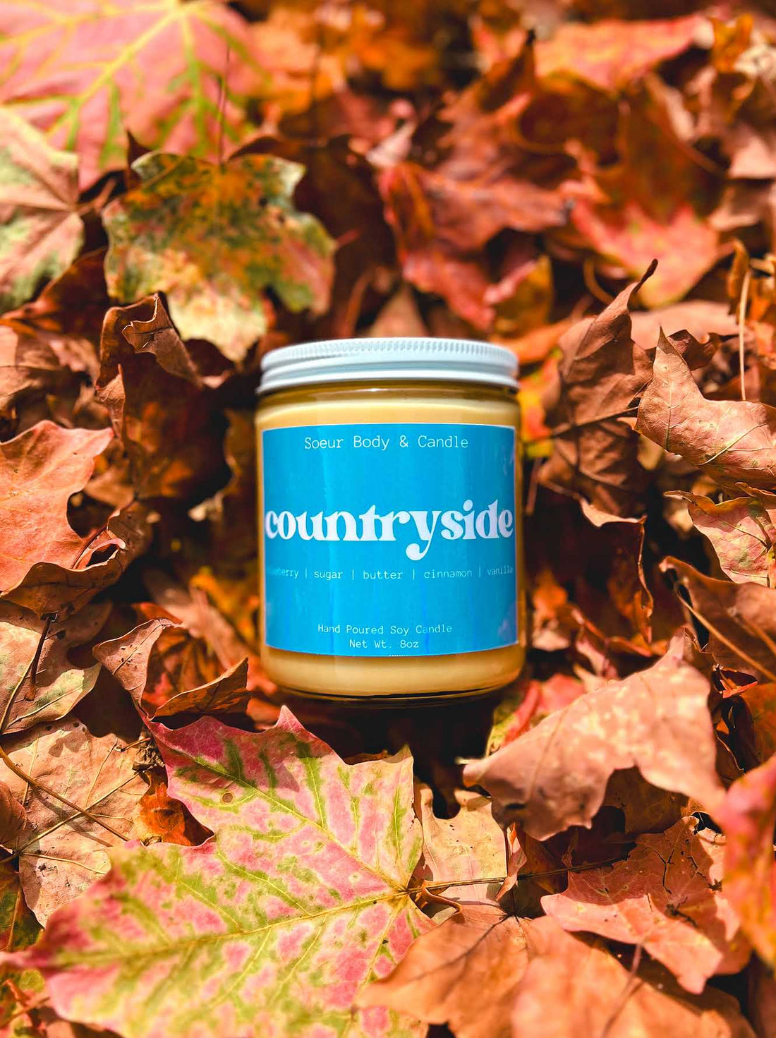 Countryside Soy Wax Candle with scents of blueberry, sugar, butter, cinnamon, and vanilla that lasts up to 45 hours! Cruelty-free, vegan, handmade, paraben and phthalate free, and sustainably packaged.