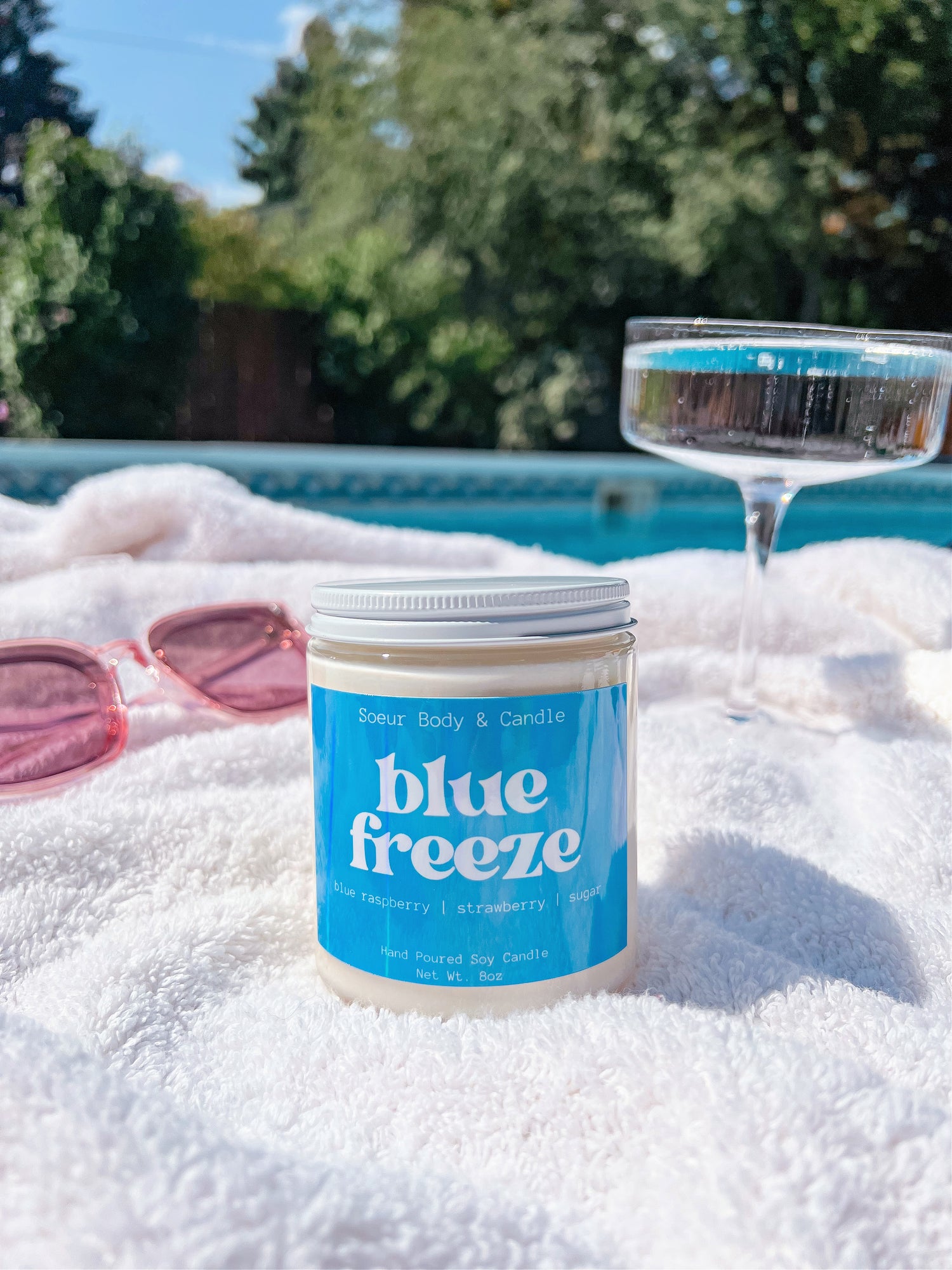 Blue Freeze Soy Wax Candle with scents of blue raspberry, strawberry, and sugar that lasts up to 45 hours! Cruelty-free, vegan, handmade, paraben and phthalate free, and sustainably packaged.