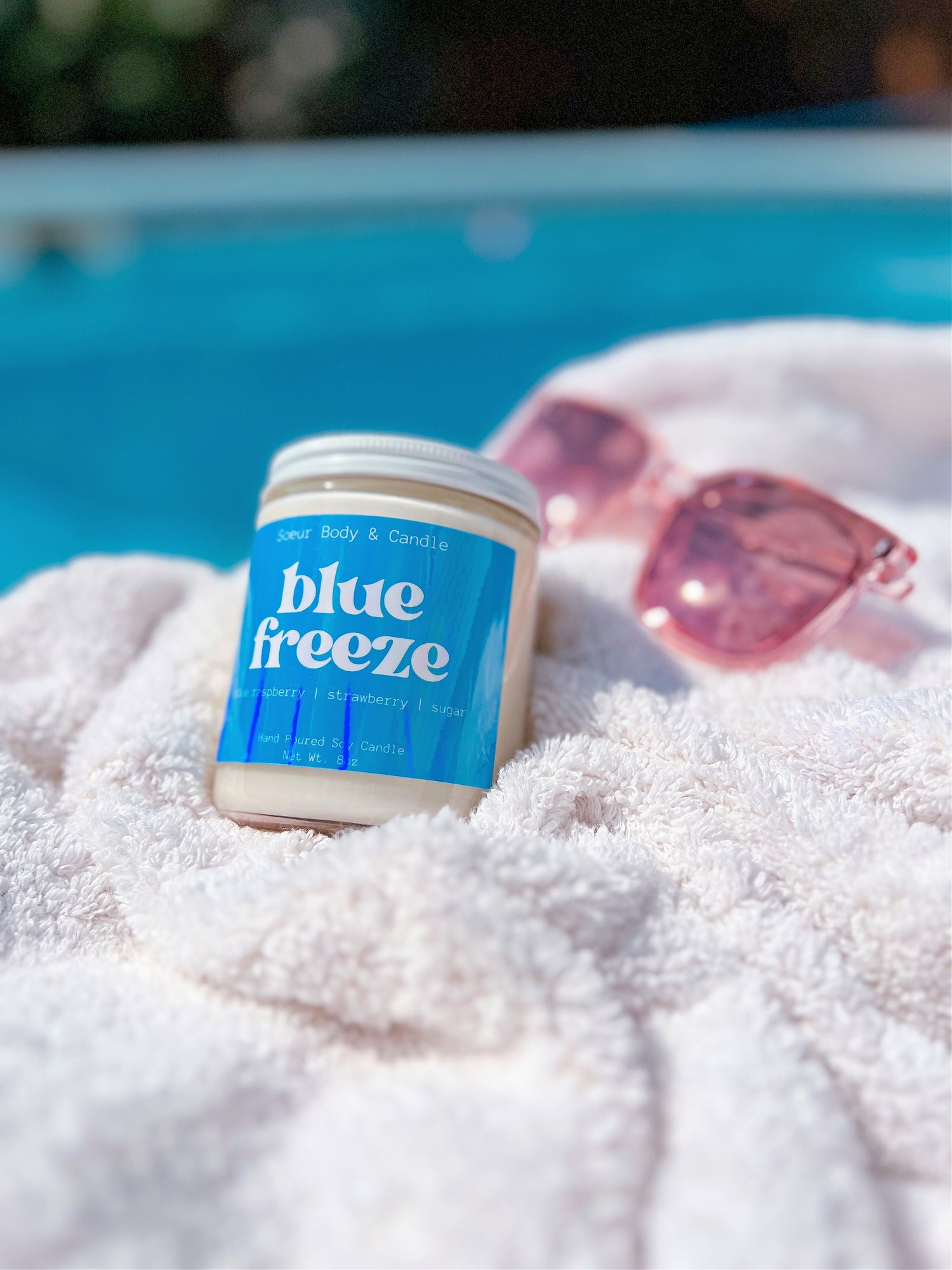 Blue Freeze Soy Wax Candle with scents of blue raspberry, strawberry, and sugar that lasts up to 45 hours! Cruelty-free, vegan, handmade, paraben and phthalate free, and sustainably packaged.