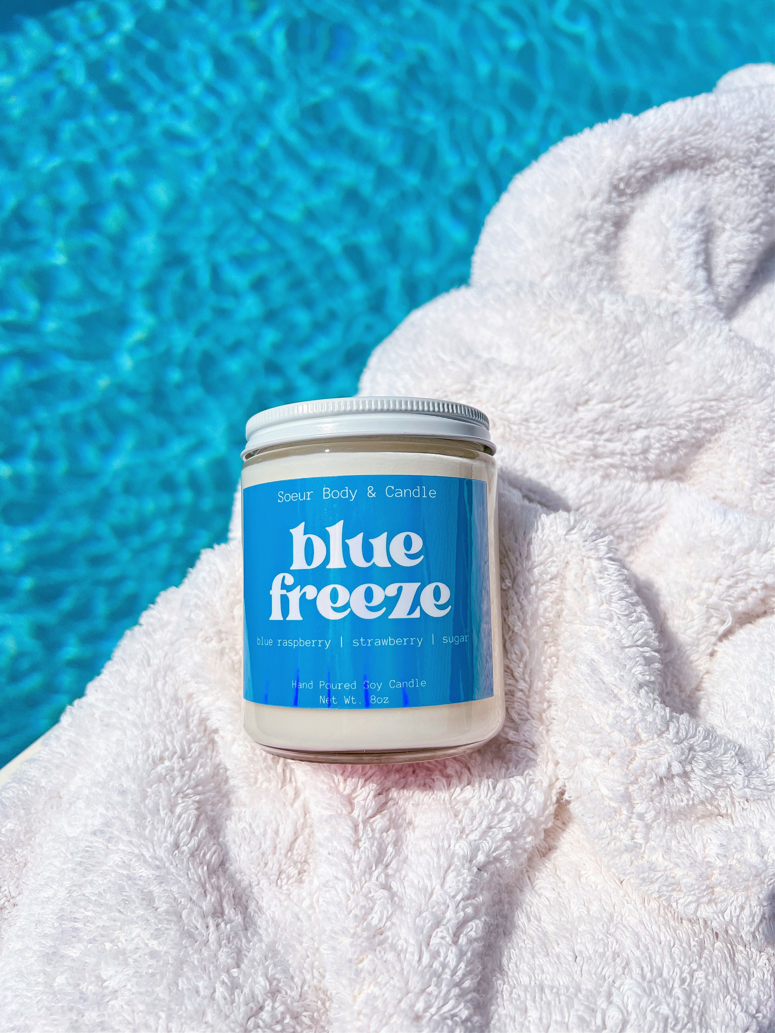 Blue Freeze Soy Wax Candle with scents of blue raspberry, strawberry, and sugar that lasts up to 45 hours! Cruelty-free, vegan, handmade, paraben and phthalate free, and sustainably packaged.