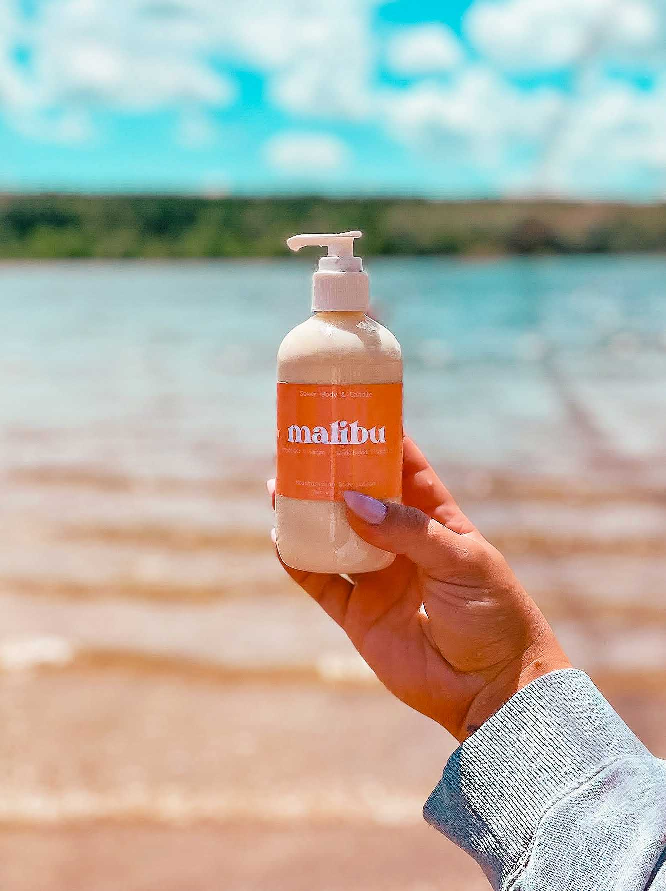 Malibu Body Lotion featuring hemp oil for moisturizing with a fresh air, lemon, sandalwood, and vanilla scent. Cruelty-free, vegan, and sustainably packaged.