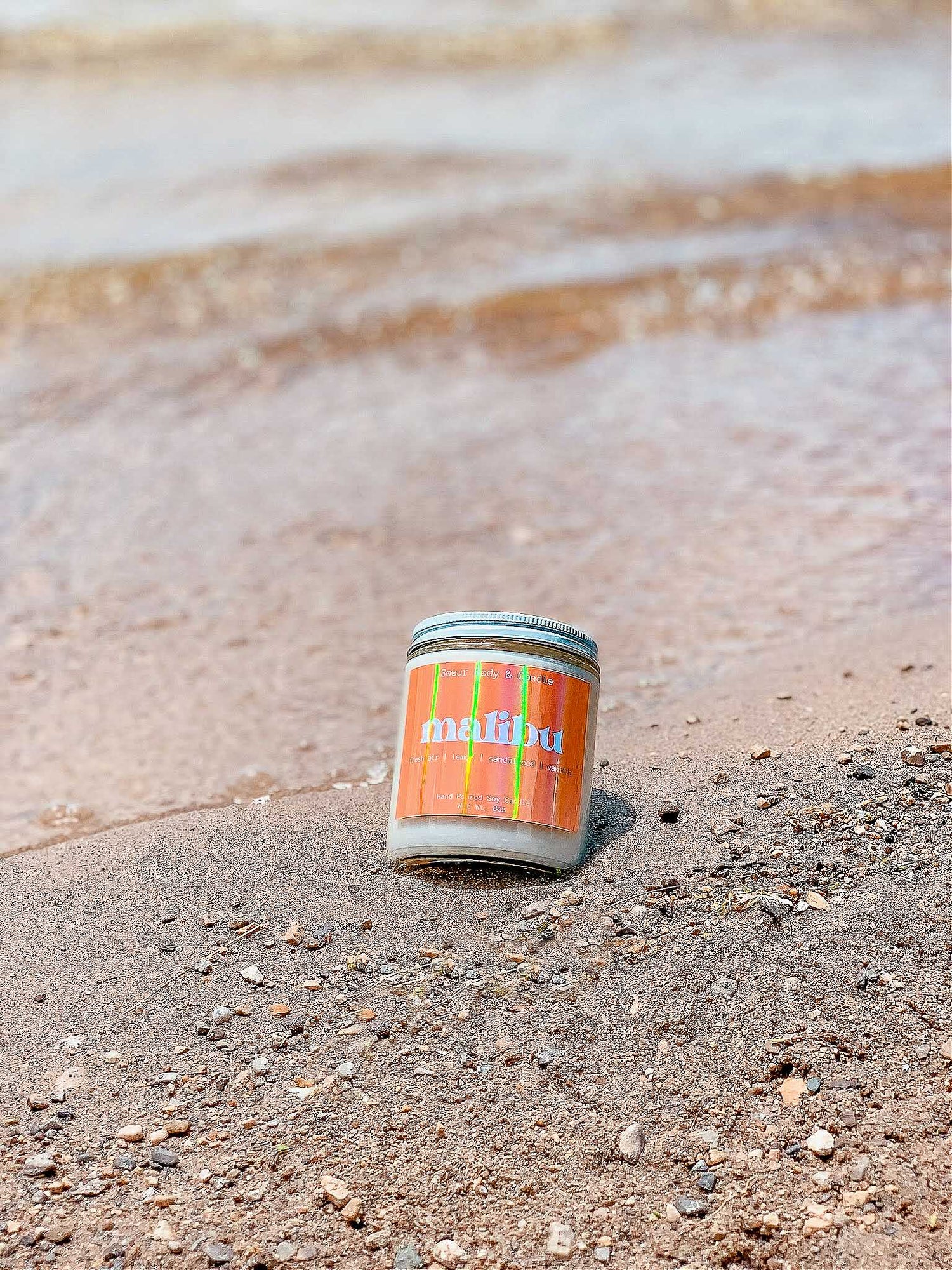 Malibu Soy Wax Candle with scents of fresh air, lemon, sandalwood, and vanilla that lasts up to 45 hours! This candle is cruelty-free, vegan, handmade, paraben and phthalate free, and sustainably packaged.