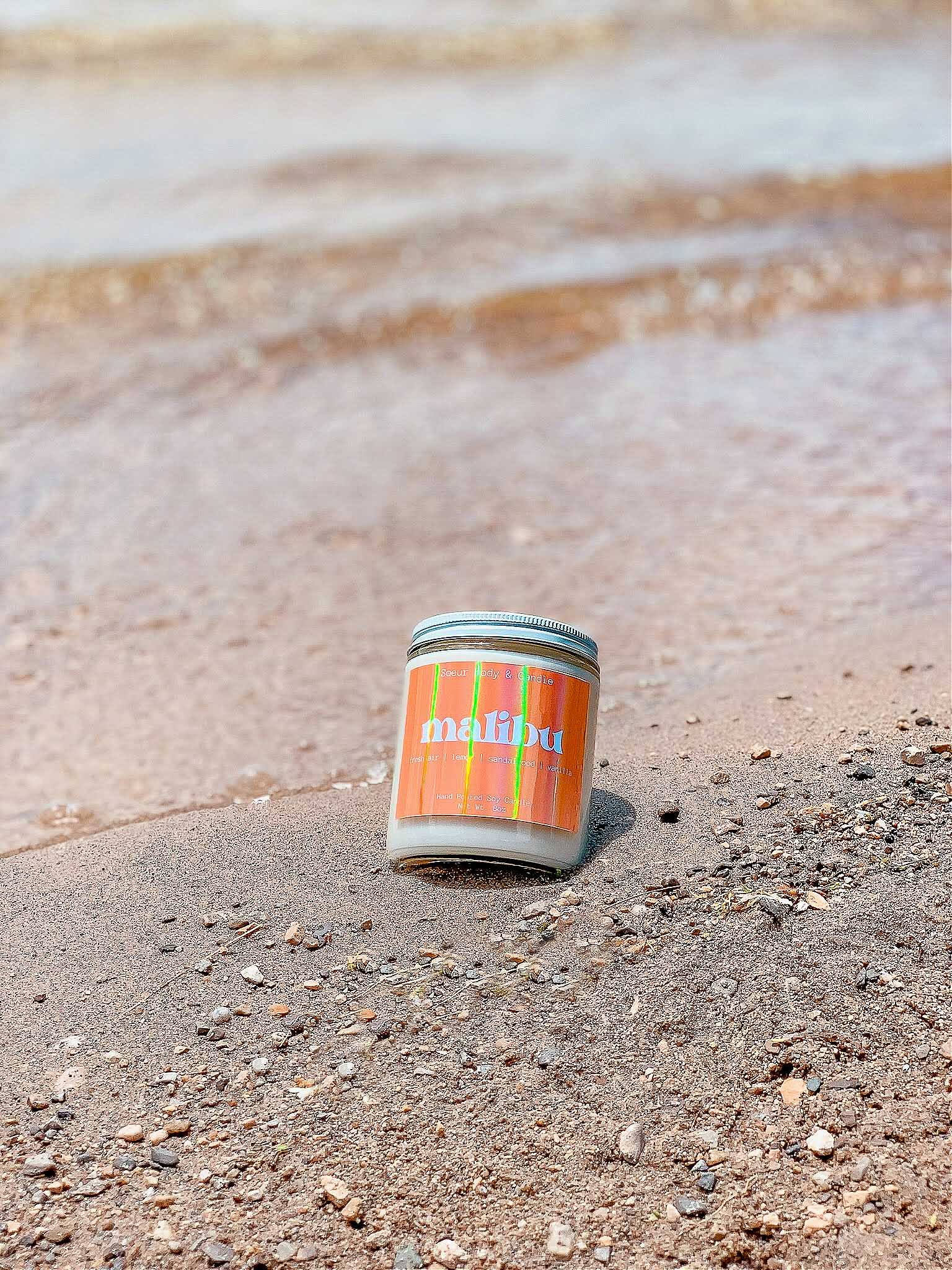 Malibu Soy Wax Candle with scents of fresh air, lemon, sandalwood, and vanilla that lasts up to 45 hours! This candle is cruelty-free, vegan, handmade, paraben and phthalate free, and sustainably packaged.