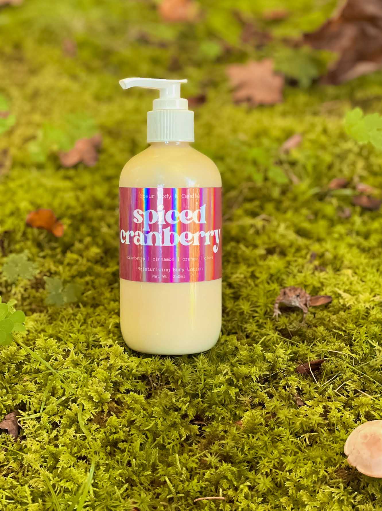 Spiced Cranberry Body Lotion featuring hemp oil for moisturizing with a cranberry, cinnamon, orange, and clove scent. Cruelty-free, vegan, and sustainably packaged. Ideal for keeping your skin soft and hydrated during the fall season!